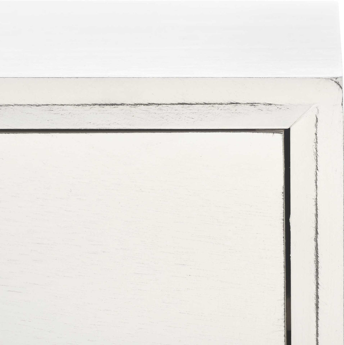 Worn edges outline the crisp white drawer frame beneath a smooth tabletop.