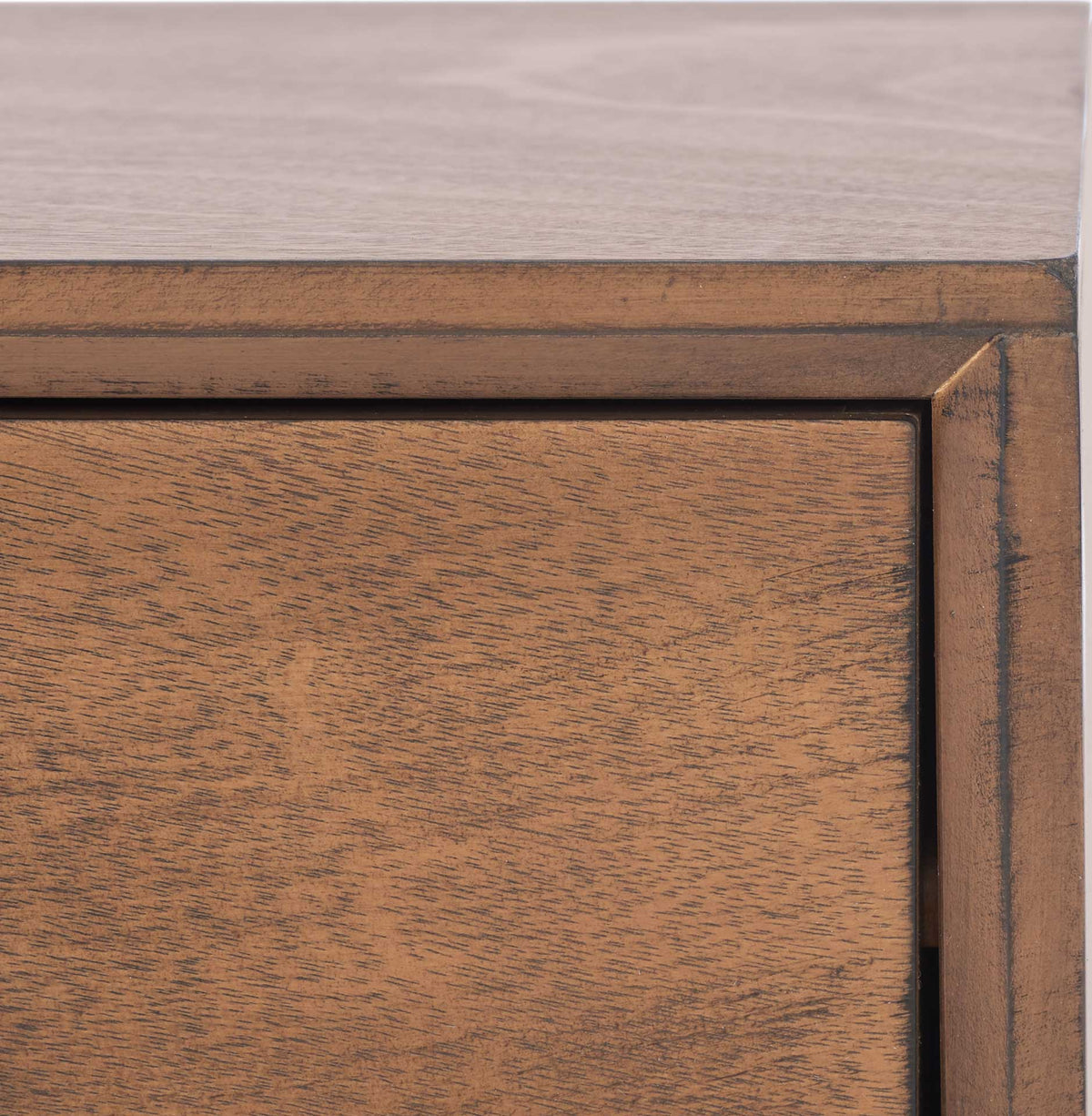 A neatly framed drawer front showcases warm brown grain and subtle texture.