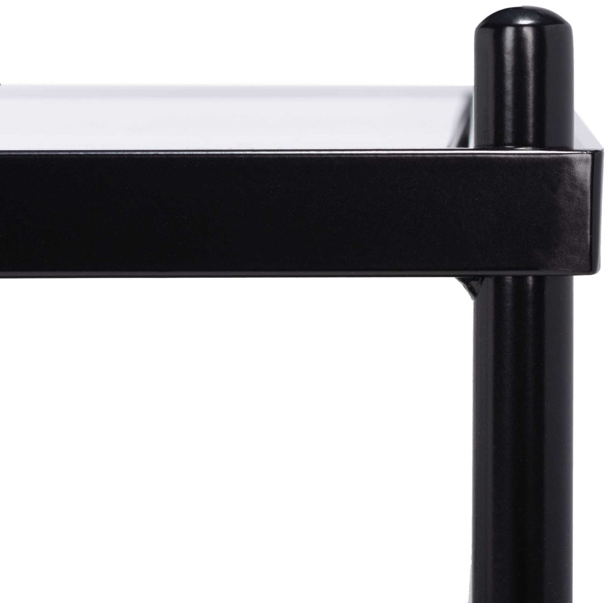 Rounded black metal posts join clean-lined rails beside the glass top for a refined finish