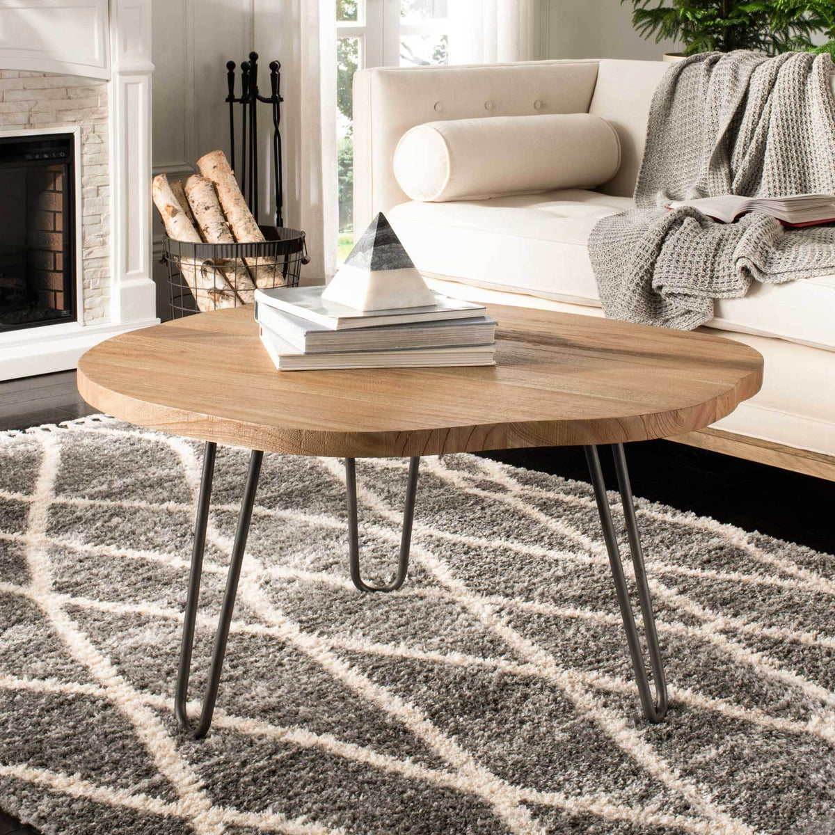 An irregular wood top and dark hairpin legs bring natural warmth to the living room