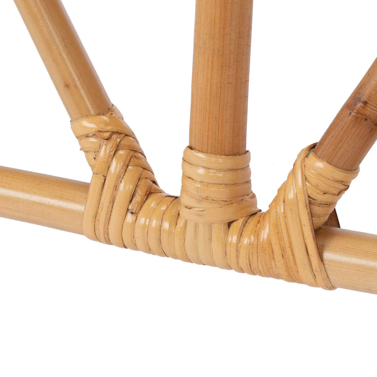 Wrapped rattan joints connect the angled supports to the lower rail.
