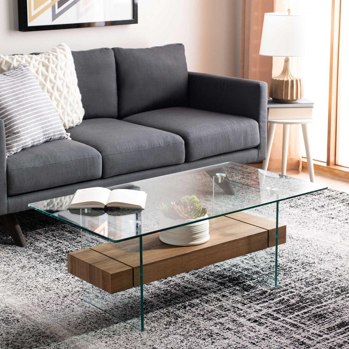 A warm brown shelf adds natural-looking contrast to this airy glass coffee table