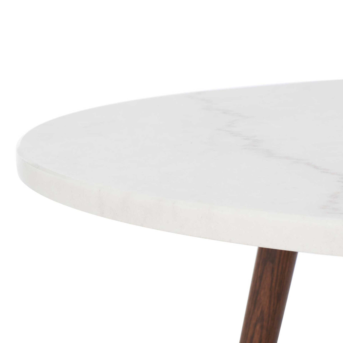 Smooth white marble tabletop highlights delicate veining along its softly rounded edge