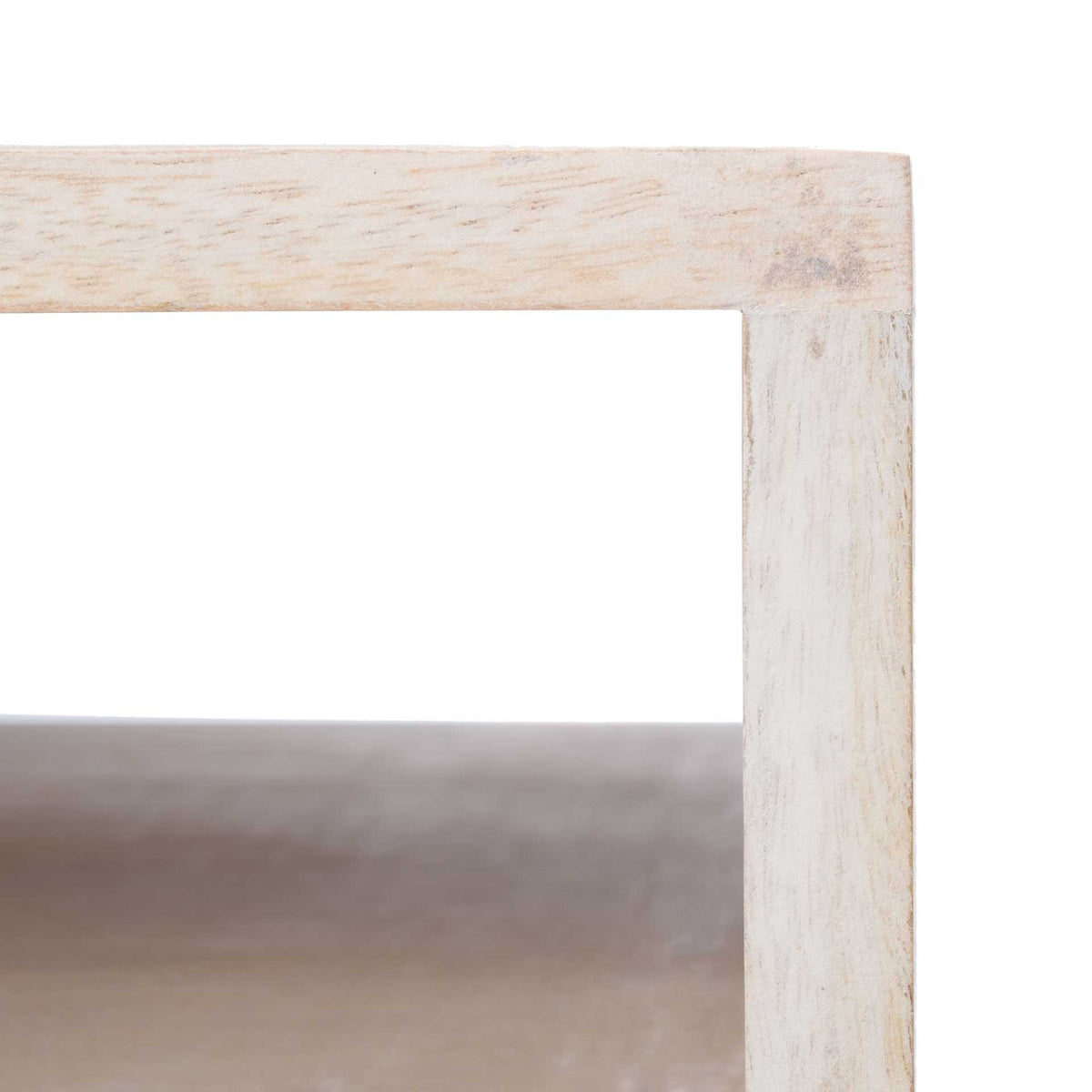 A whitewashed wood frame surrounds the open shelf, revealing warm wood grain inside