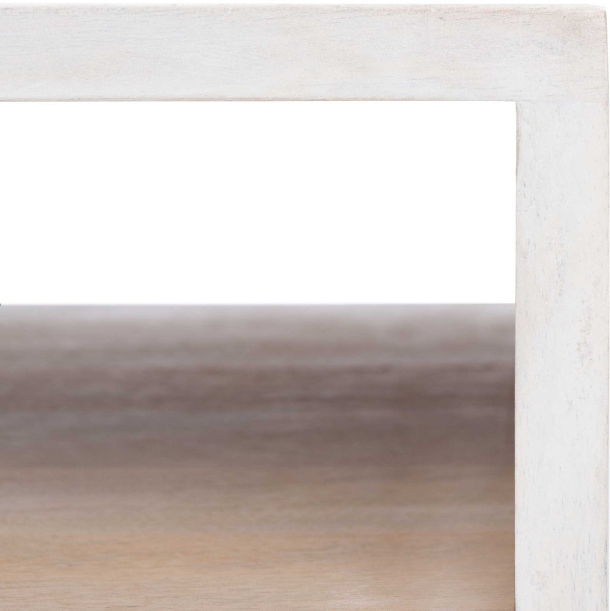 The open shelf reveals wood-lined storage and a soft whitewashed finish