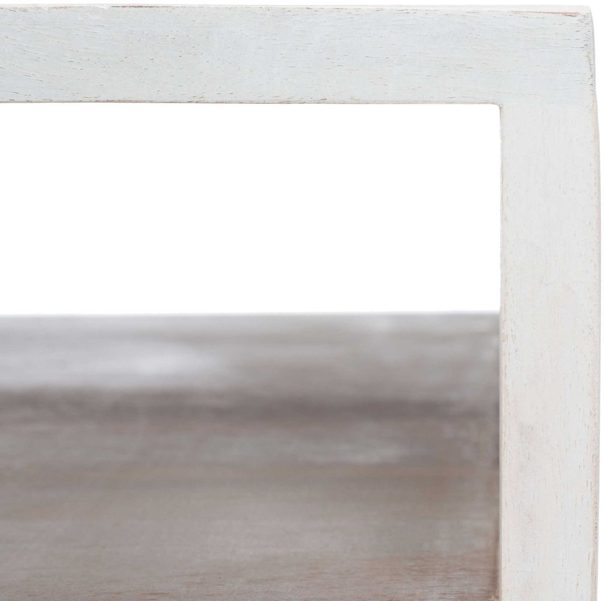 Whitewashed wood surrounds a spacious open cubby with a gently grained shelf.