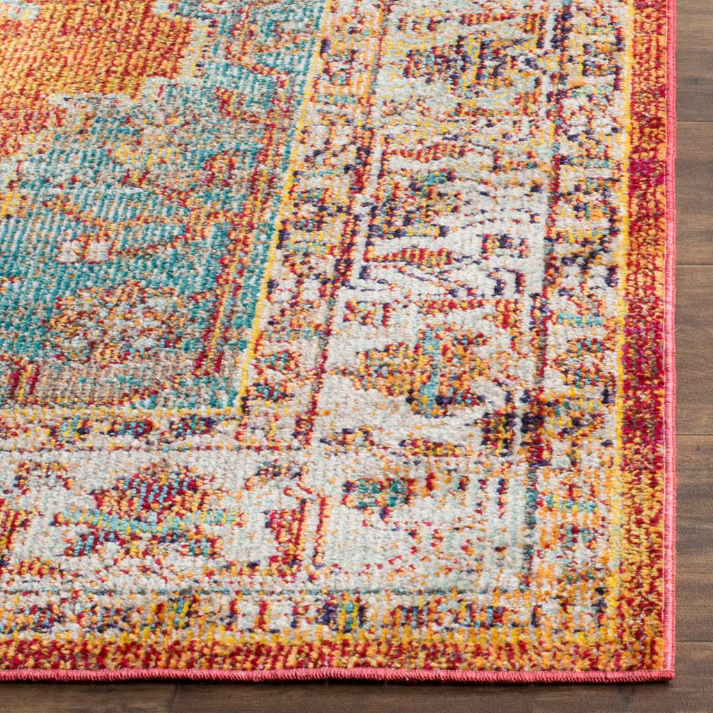 Dense orange and blue motifs meet a neatly bound red edge at the rug's colorful corner.