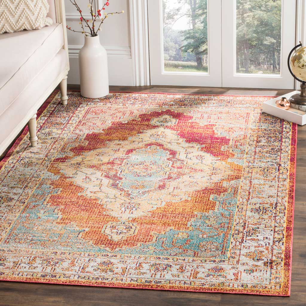 A bright orange medallion and pale blue flourishes add lively color to the rug's ornate design.