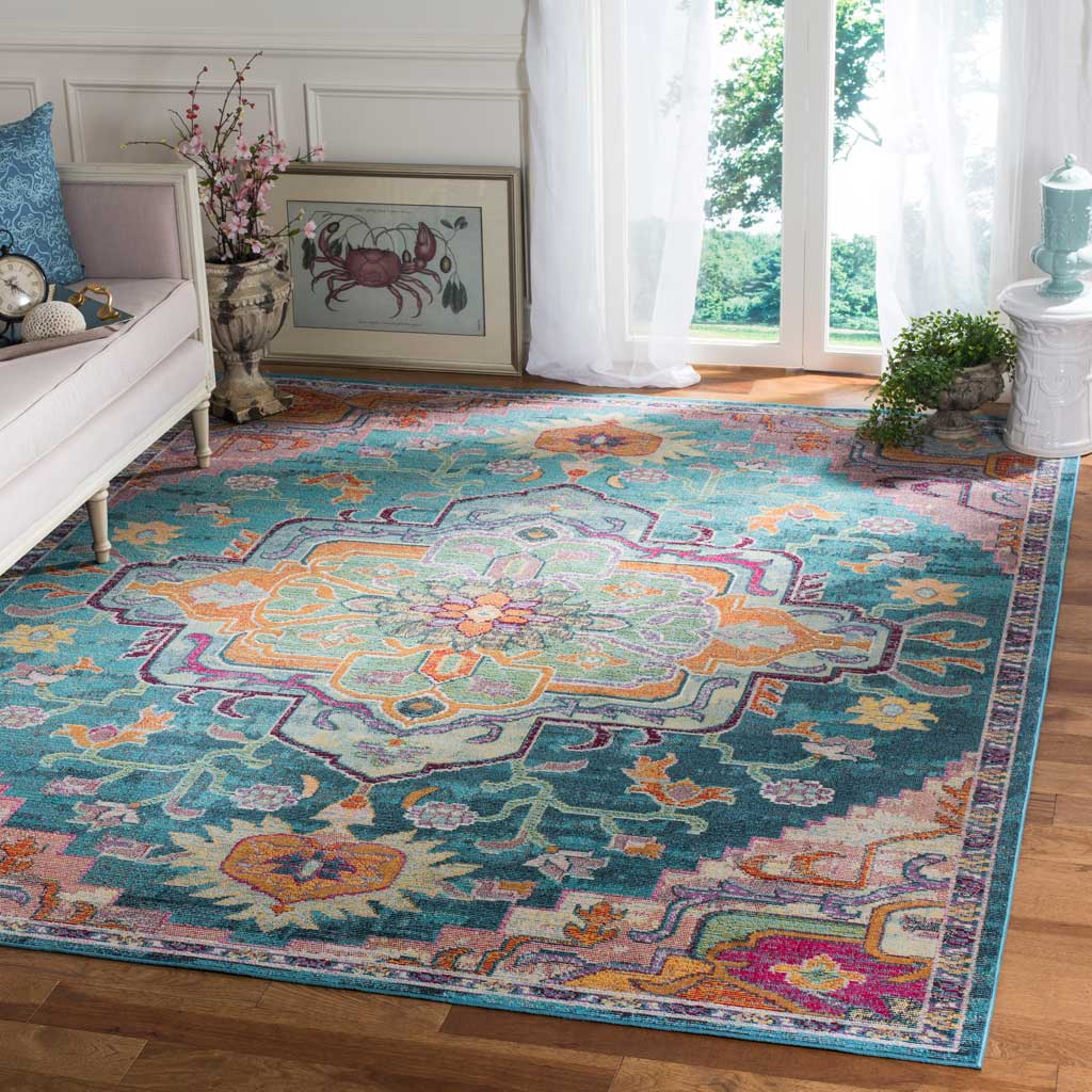 A rose-accented medallion and colorful floral motifs stand out against this rug's teal ground