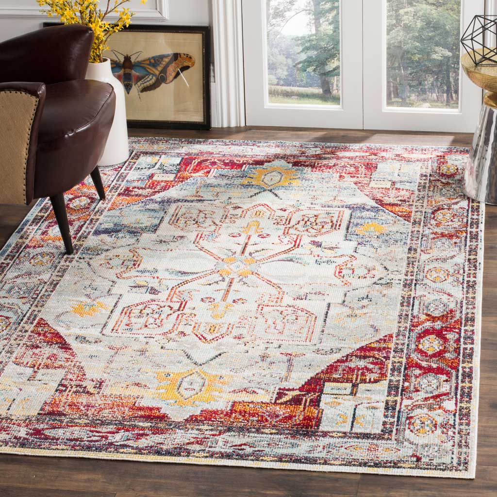 A light blue and red medallion rug brings colorful traditional pattern to a bright living space