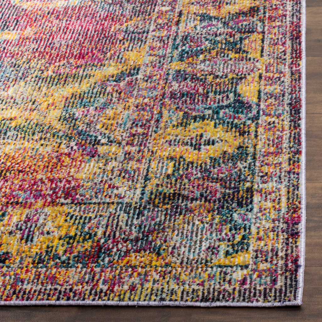 Gold and navy floral motifs frame the bound edge of a richly colored, low-profile rug