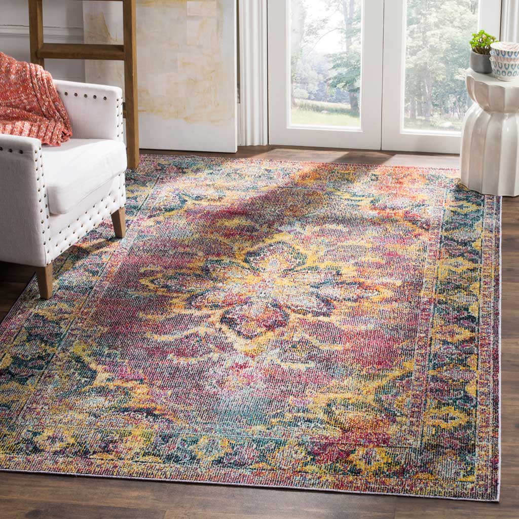 Navy and light blue floral rug brings warm gold accents beneath a white accent chair