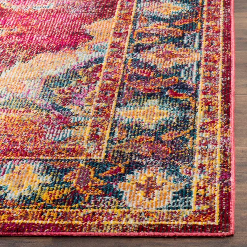 Ruby, navy, and gold floral details meet the neatly bound edge of this vibrant area rug