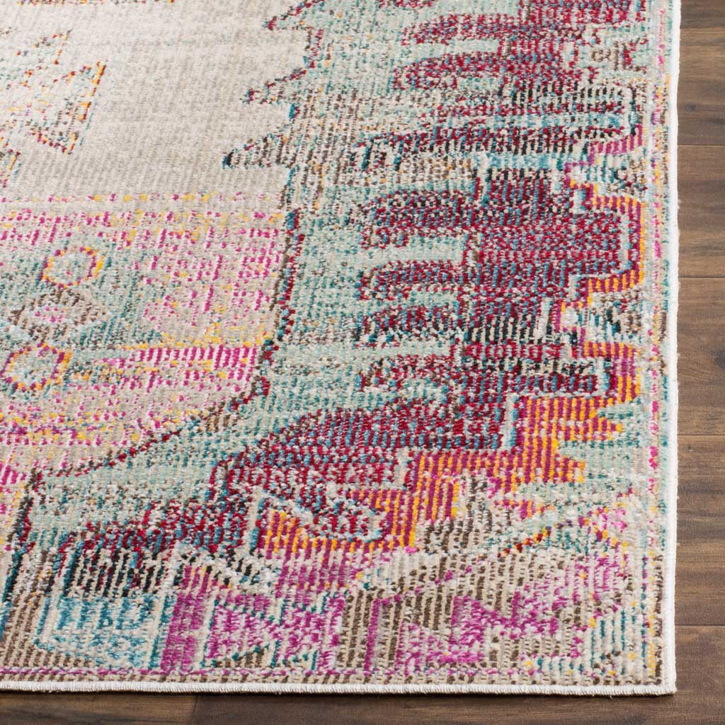 Plum, aqua and pink yarns bring the ornate border of this low-profile rug to life.