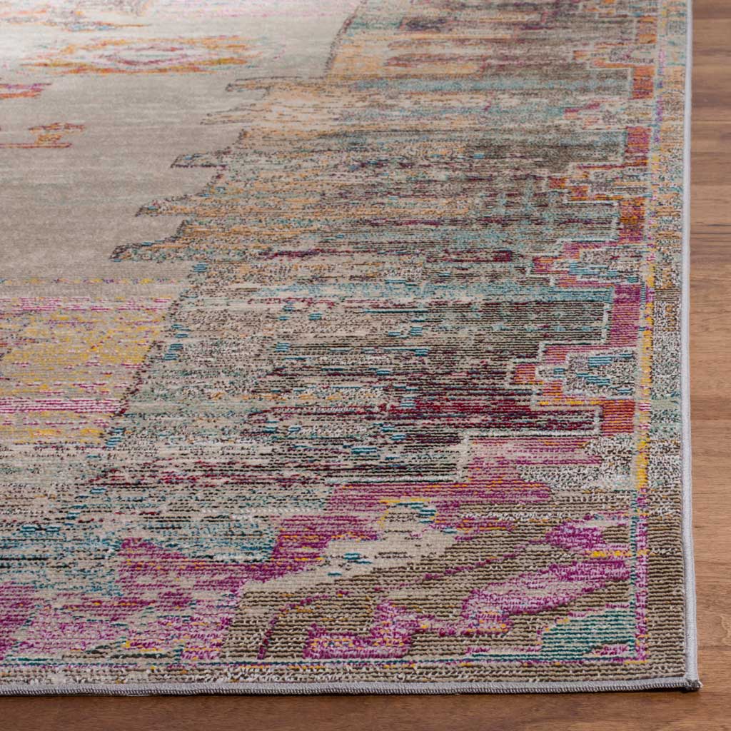 Neatly bound edges finish a low-profile weave of soft gray, teal, orange and purple.