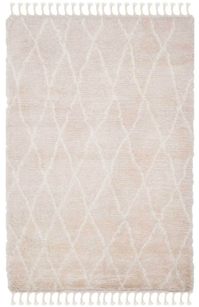 Soft beige shag pile is traced with an ivory lattice and knotted fringe