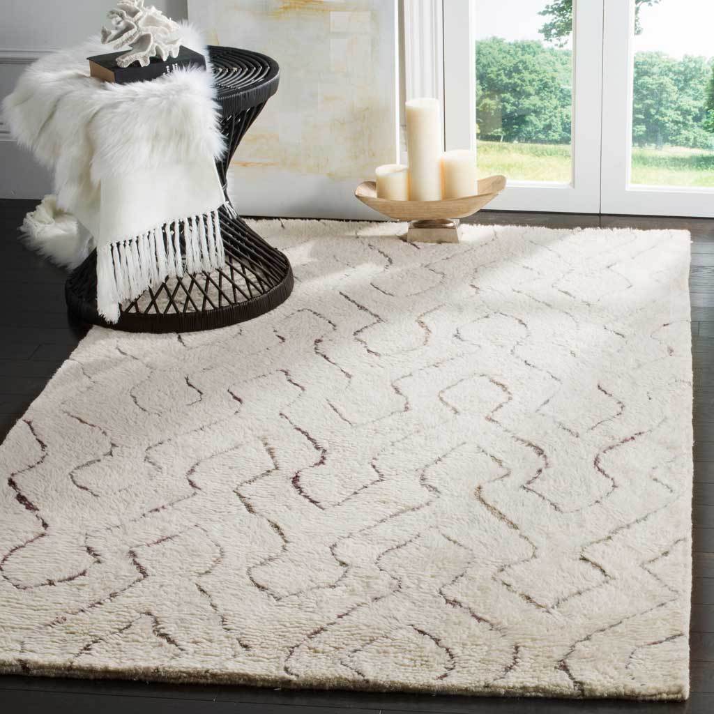 A cozy ivory shag rug adds soft texture and meandering geometric lines to a light-filled room.
