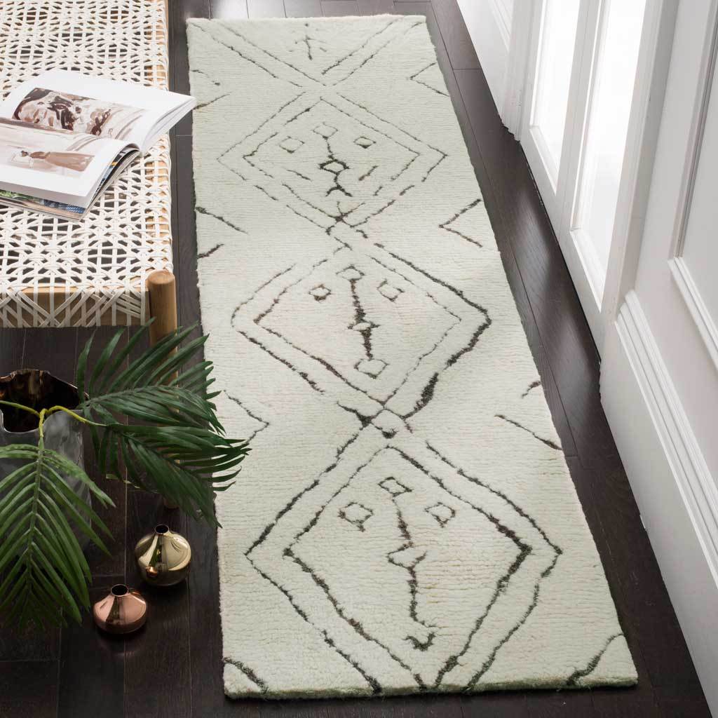Hand-tufted ivory runner with sketch-like diamonds that add warmth to narrow spaces