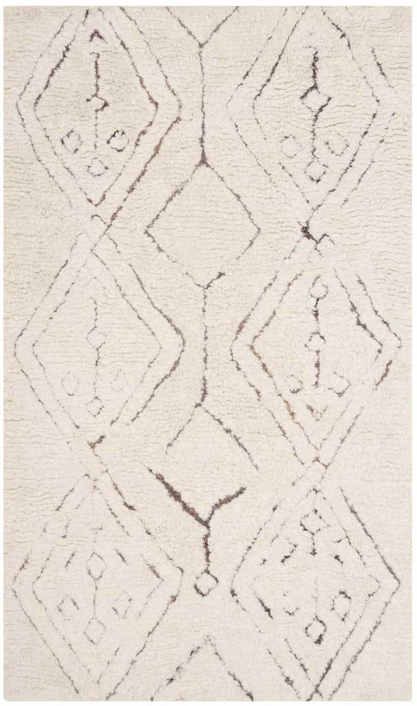 Ivory rectangular rug with oversized sketched diamonds and scattered charcoal markings