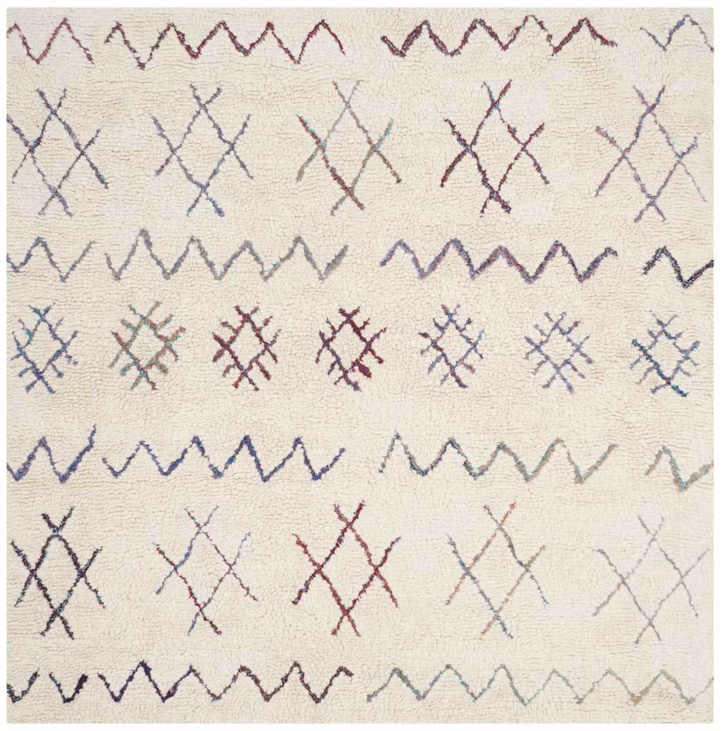 A square ivory rug pairs colorful crossed-line motifs with playful, uneven zigzag bands.