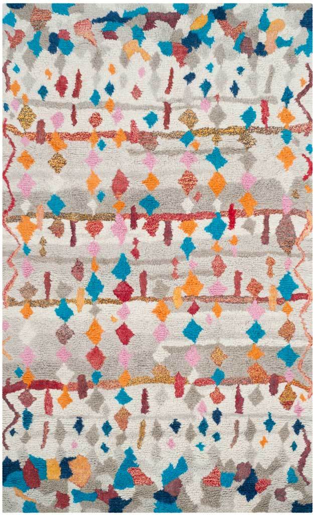 Plush ivory rug with scattered multicolored shapes and layered rust-toned bands.