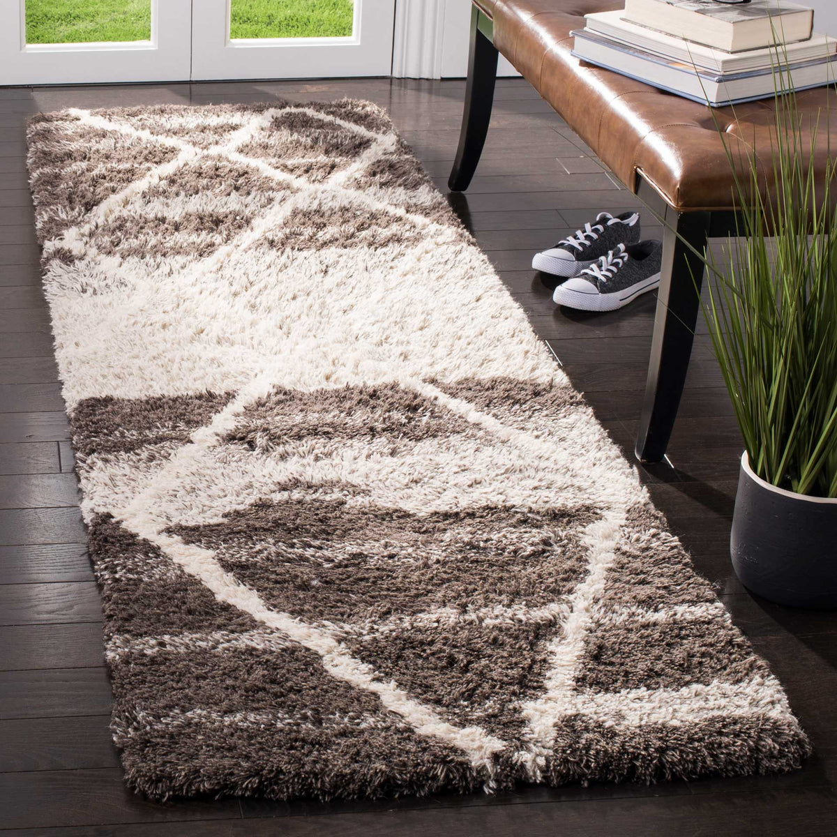 Thick wool pile and a sand and ivory diamond design bring cozy texture to this runner