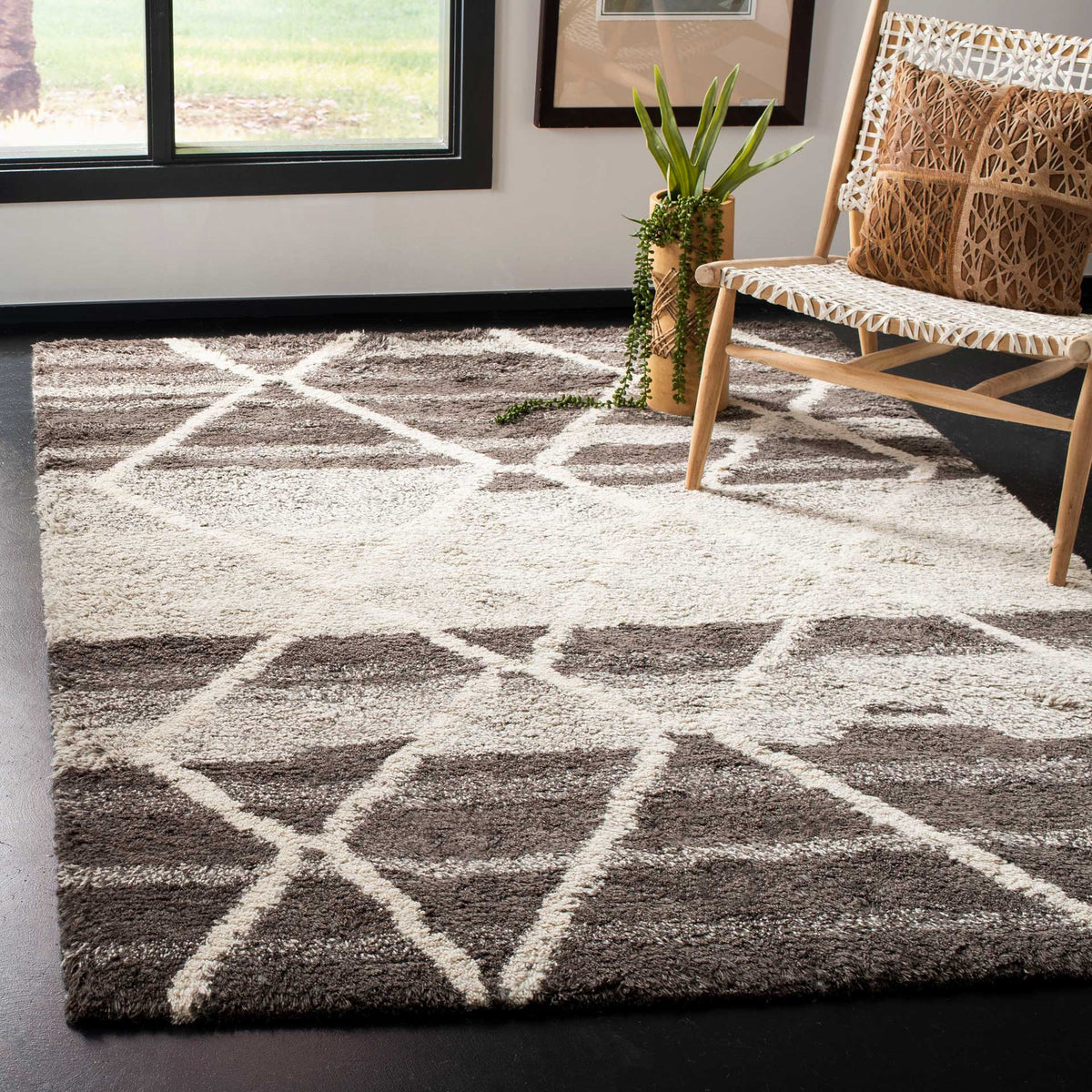 A sand-and-ivory diamond rug brings warm contrast and plush comfort to the space.