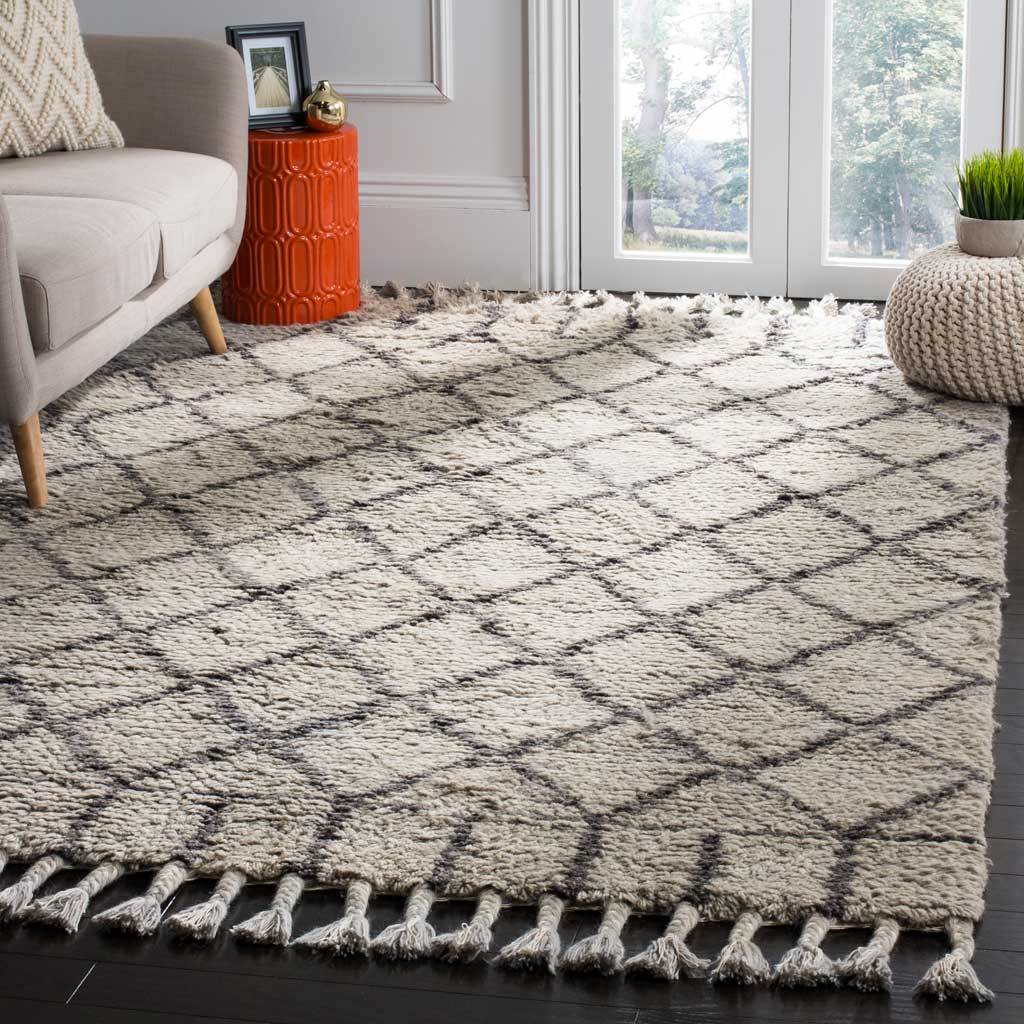 Plush gray and dark gray diamond rug adds graphic softness to a living area