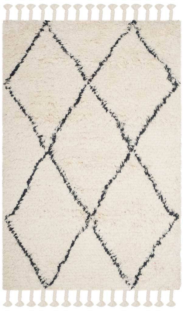 Irregular dark gray diamonds lend handcrafted character to an ivory rug with tasseled ends.