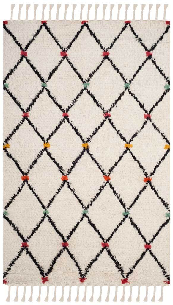 Ivory shag rug with bold black diamonds, pops of red, orange, and green, and fringed edges