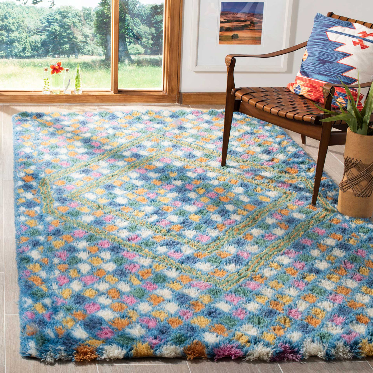 Vibrant blue and ivory rug brings plush texture and colorful diamonds to a sitting area