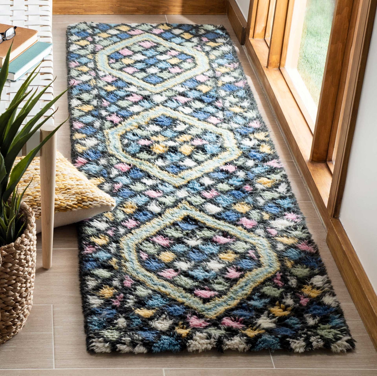 Deep blue runner adds soft texture and bold gold-framed motifs to a hallway
