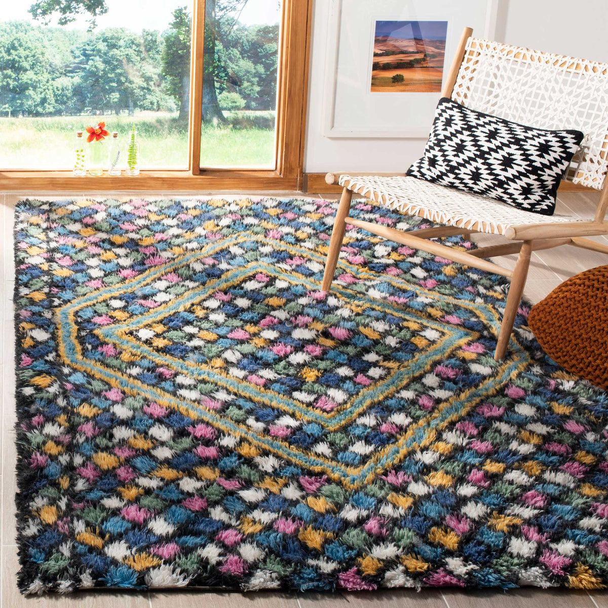 Layered diamond motifs and vibrant tufted colors enliven a plush navy rug