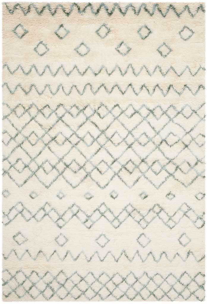 Plush ivory rug with pale blue diamonds and zigzag bands adds subtle geometric texture