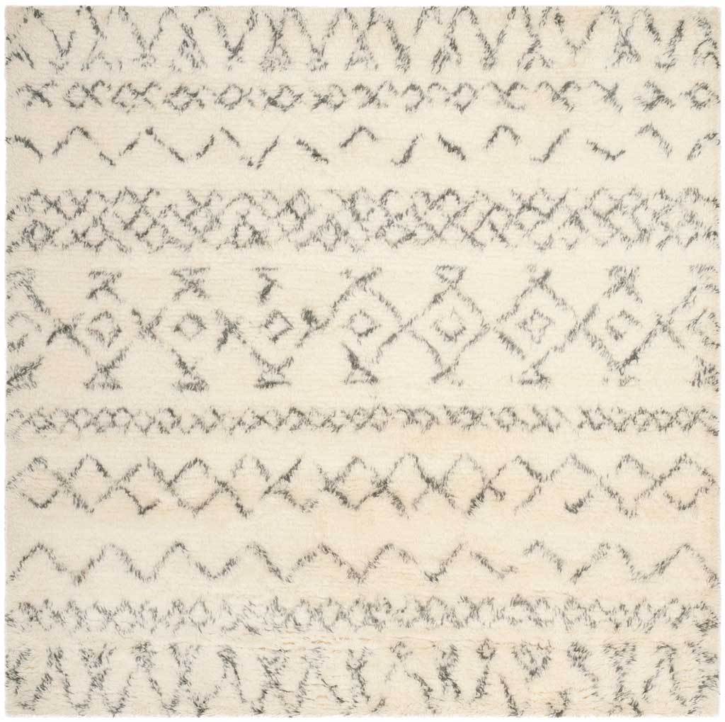 Square ivory shag rug with gray diamond motifs, wavering zigzags, and soft textured pile