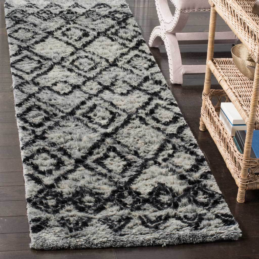 Plush gray and charcoal runner rug with layered diamond motifs and a soft wool-blend pile