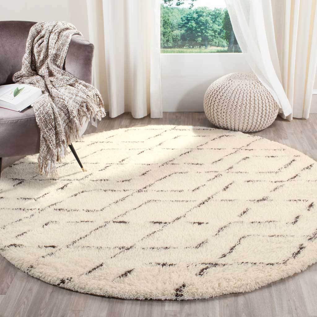Soft ivory pile and brown linework bring cozy contrast to a bright living room