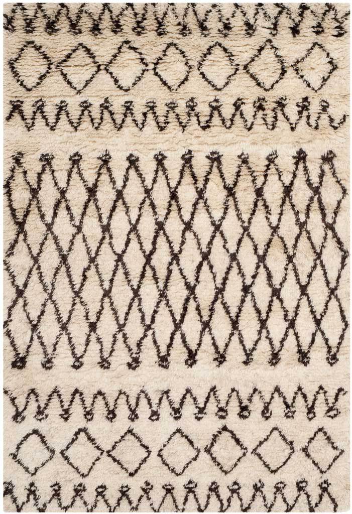 Rich brown diamonds and fine zigzag borders add bold geometric contrast to a small ivory rug.