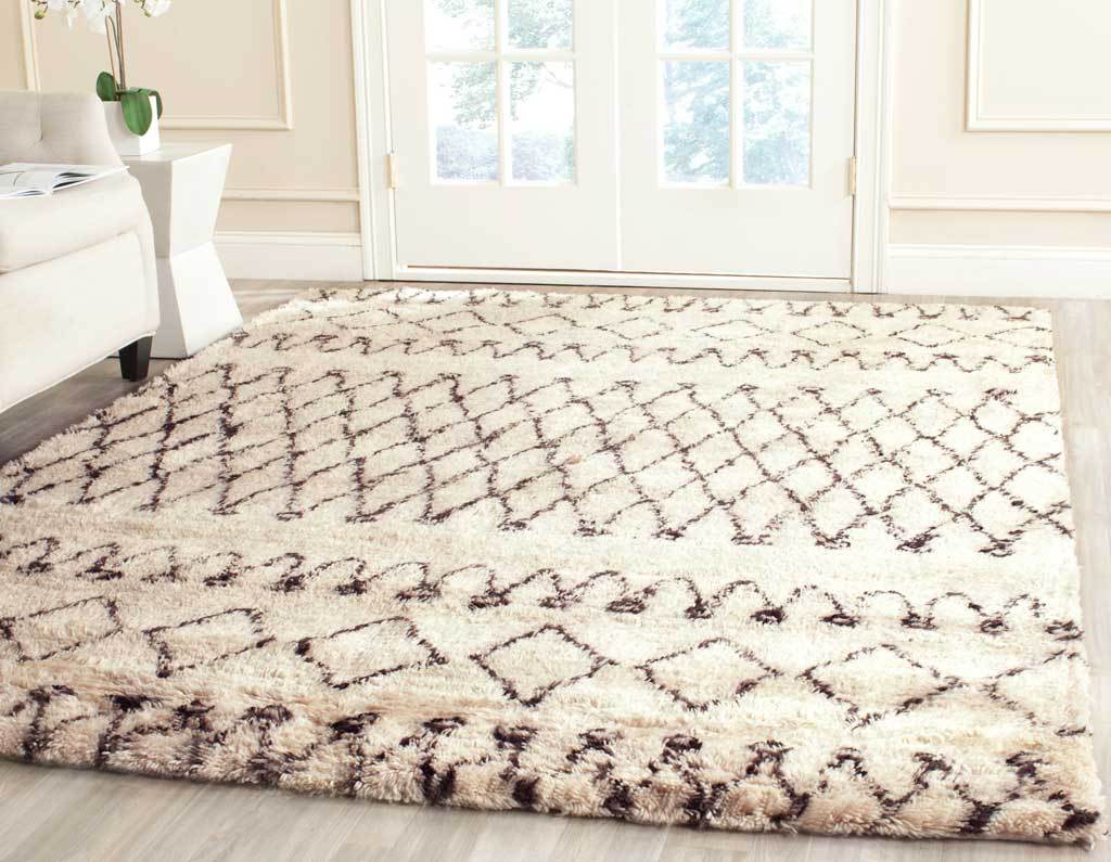 A deep ivory pile and dark brown diamond lattice bring cozy, graphic texture to the floor.
