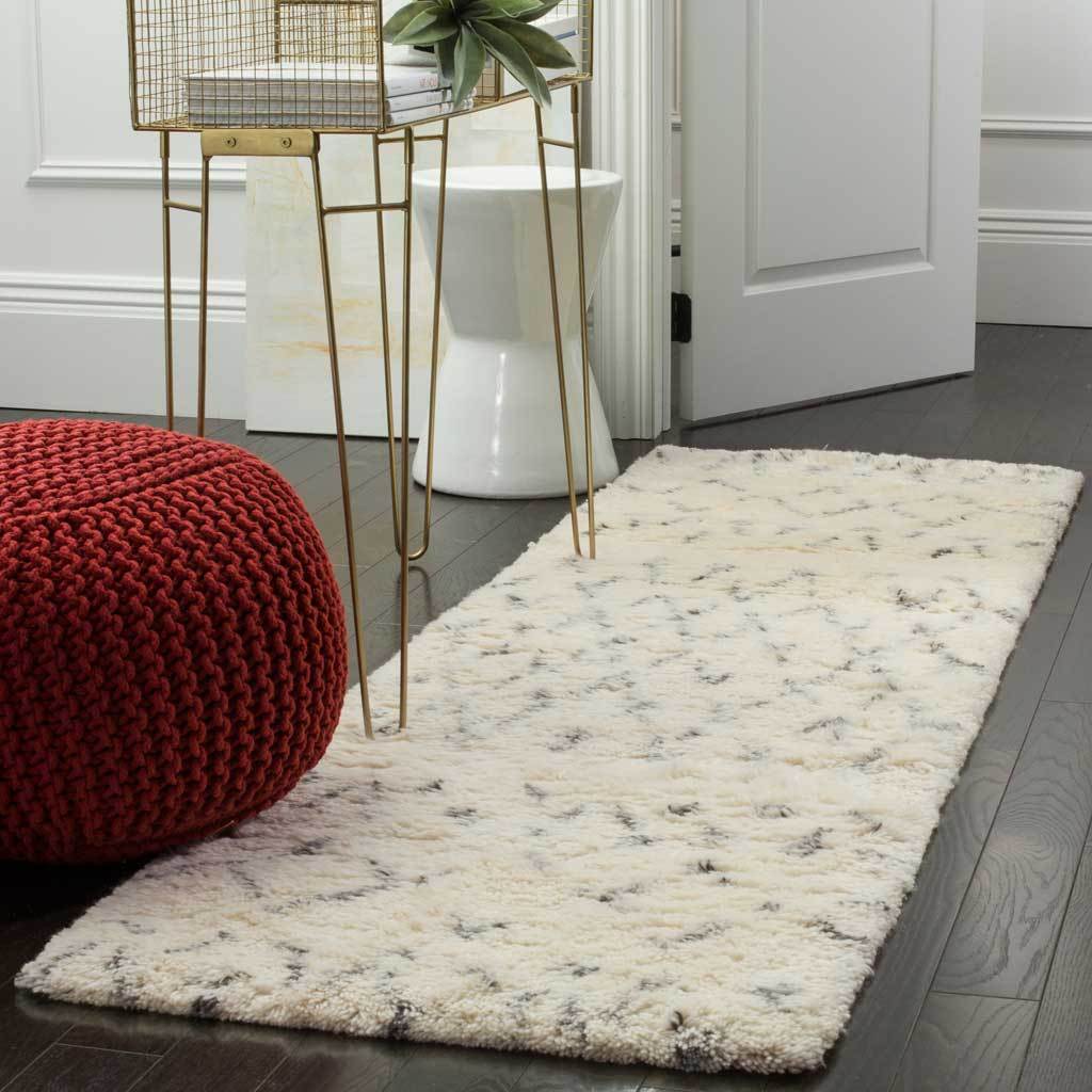 Soft ivory and gray runner brings cozy texture and a subtle pattern to an entryway