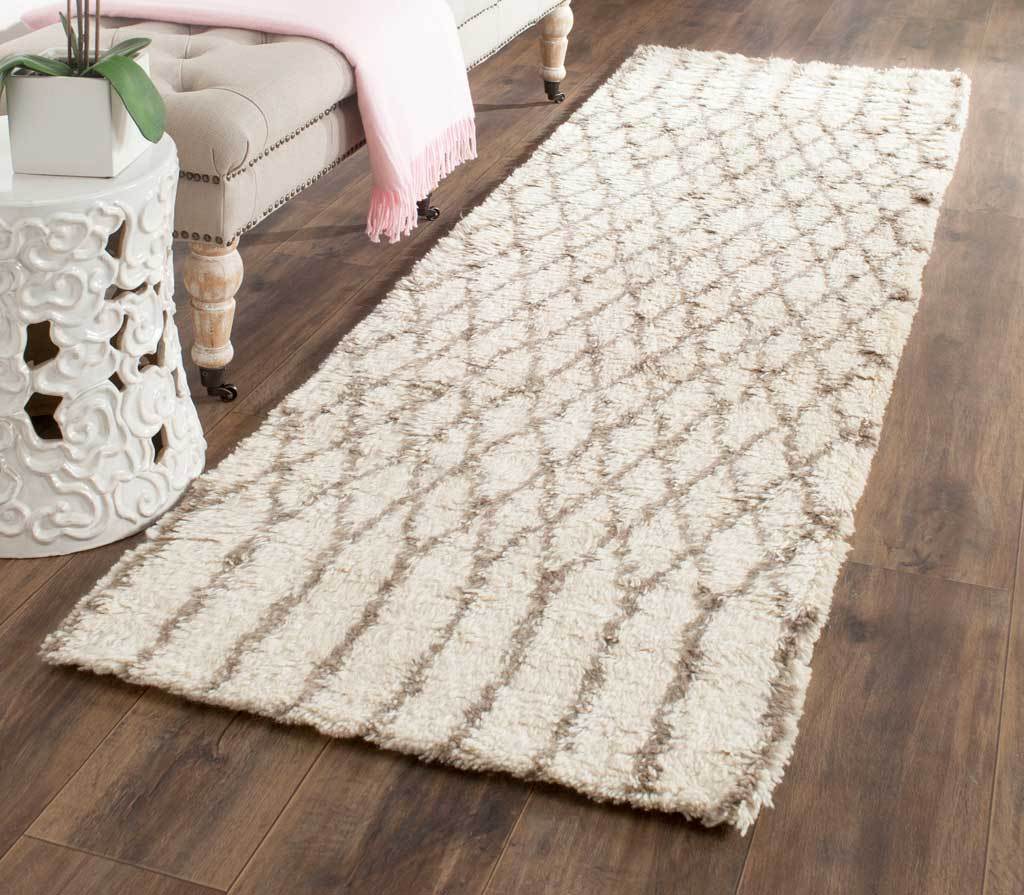 Ivory and gray diamond-patterned runner brings plush warmth and a graphic accent to wood floors