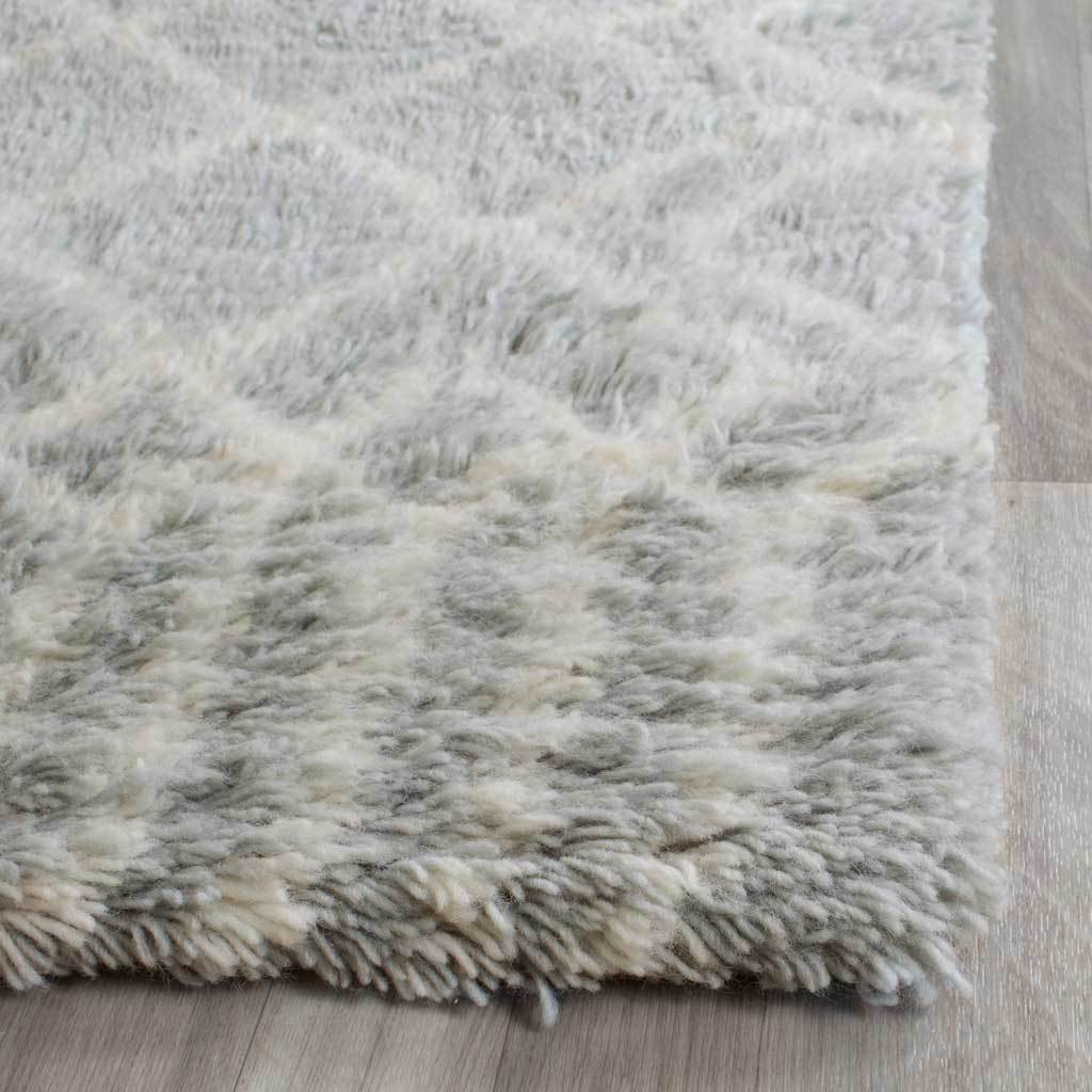 Thick wool-blend shag pile gives the pale blue and ivory runner a soft, textured edge.