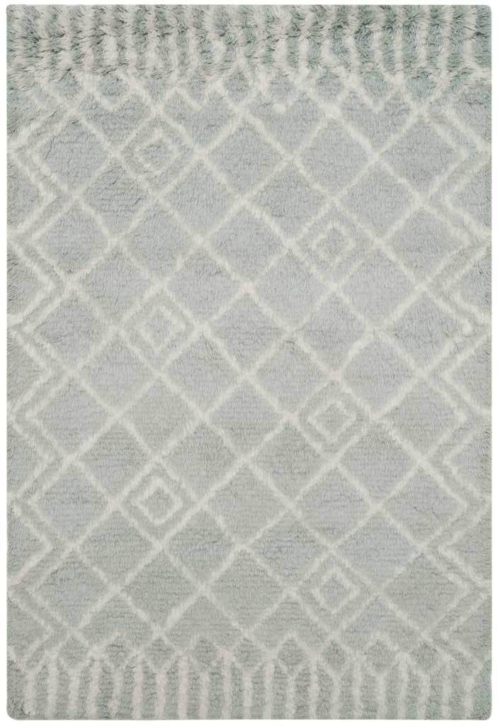 Blue-and-ivory shag pile brings softness to a bold diamond pattern