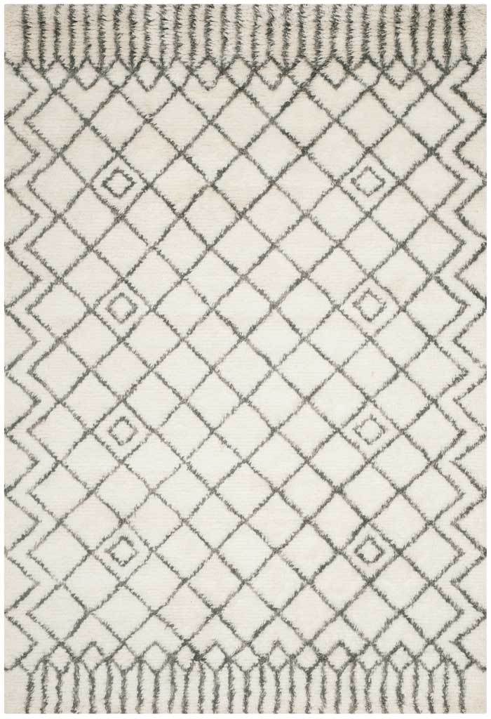 Deep gray lines and inset diamonds stand out on soft ivory pile
