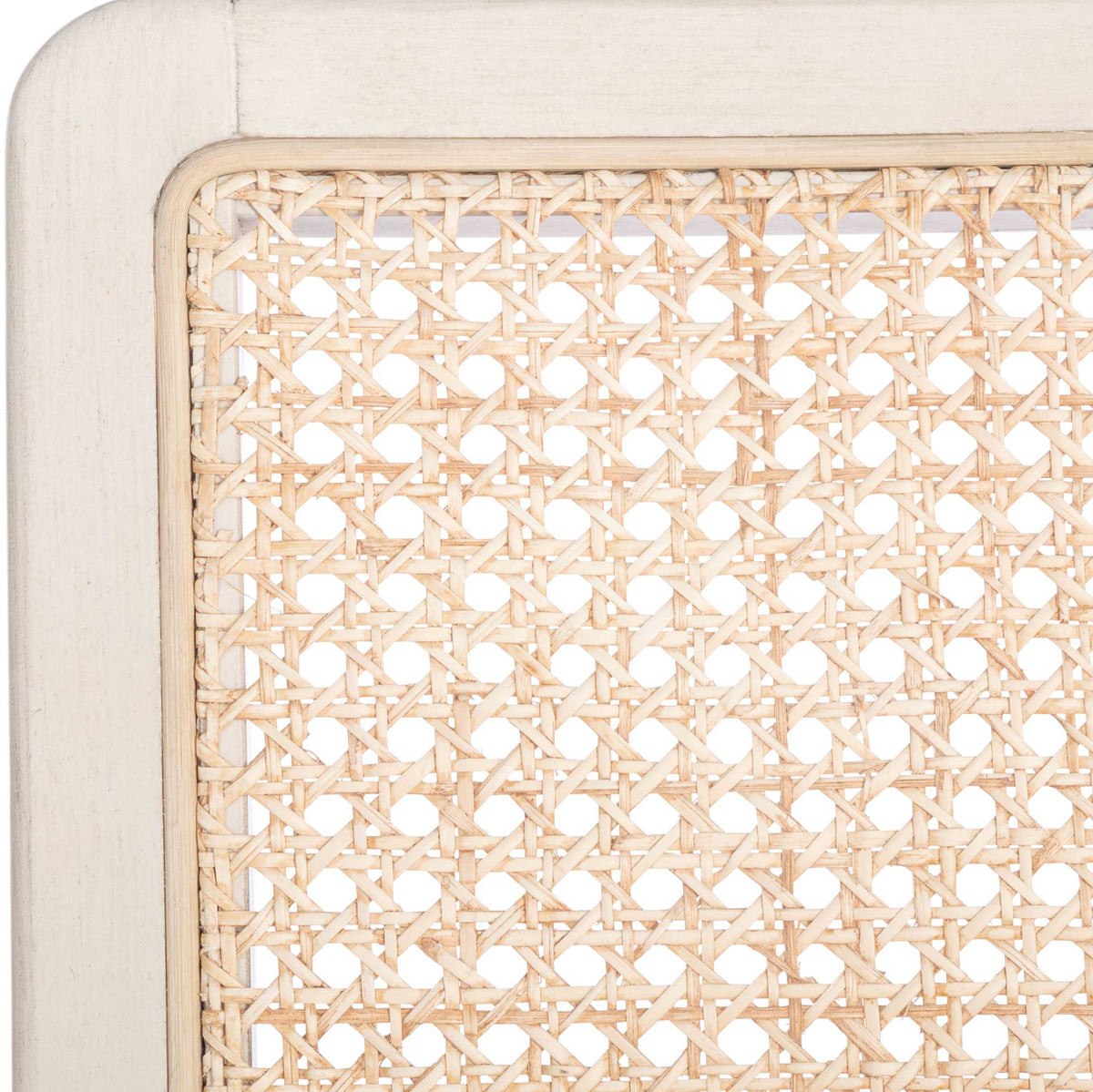 Natural rattan weave contrasts with the softly rounded white wood backrest