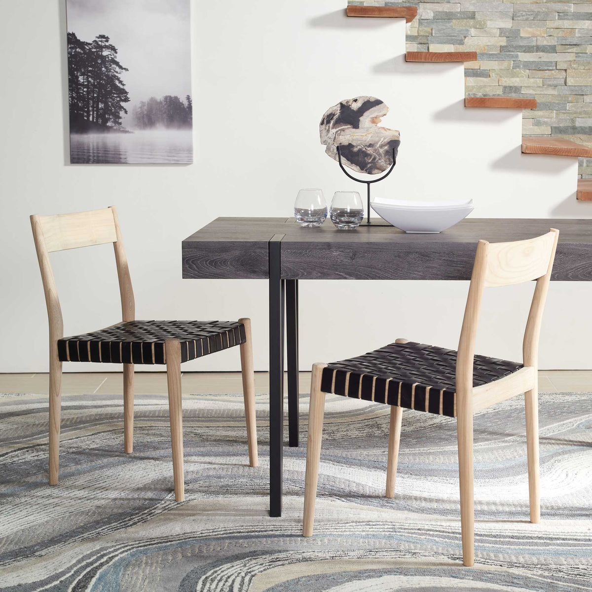 Black basket-woven leather seats complement natural wood frames around a dining table