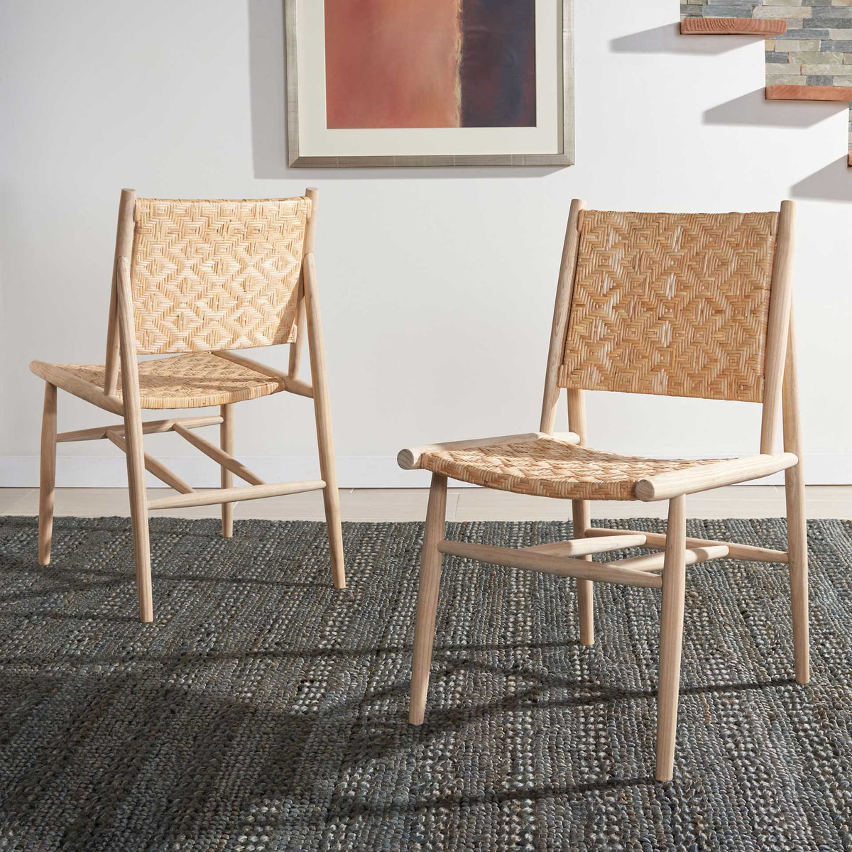 Matching rattan dining chairs bring warm woven texture and light wood tones to a dining room