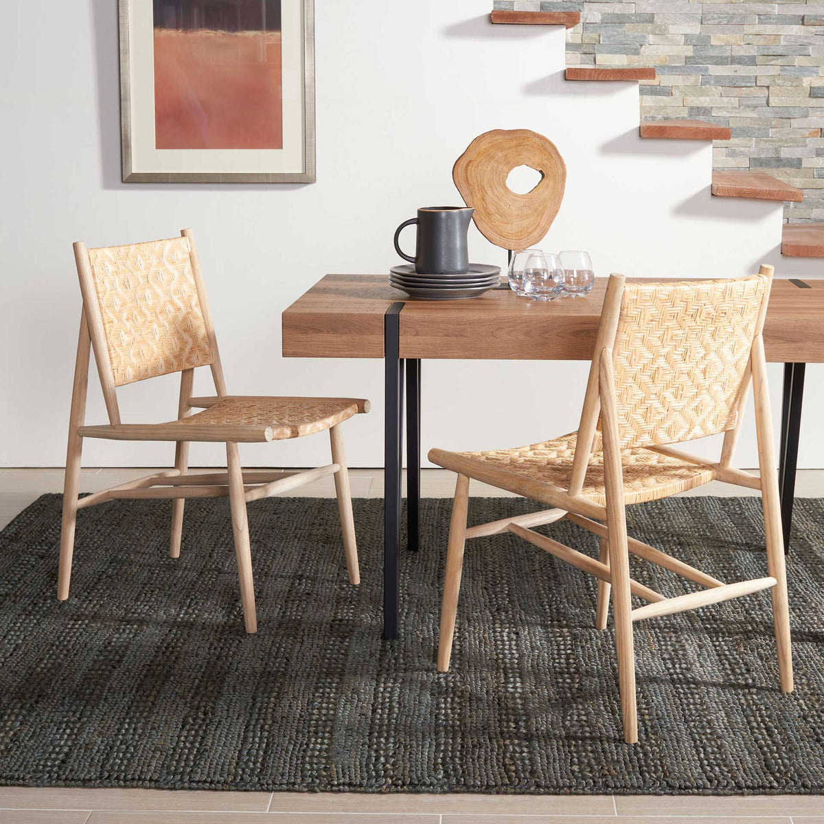 Slender wooden legs and woven rattan seats keep these dining chairs light and inviting