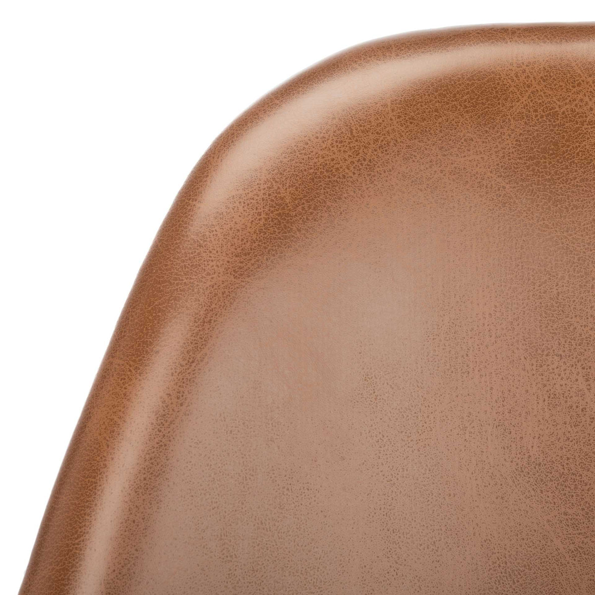 Fine-grained cognac faux leather wraps the gently rounded edge of the chair back