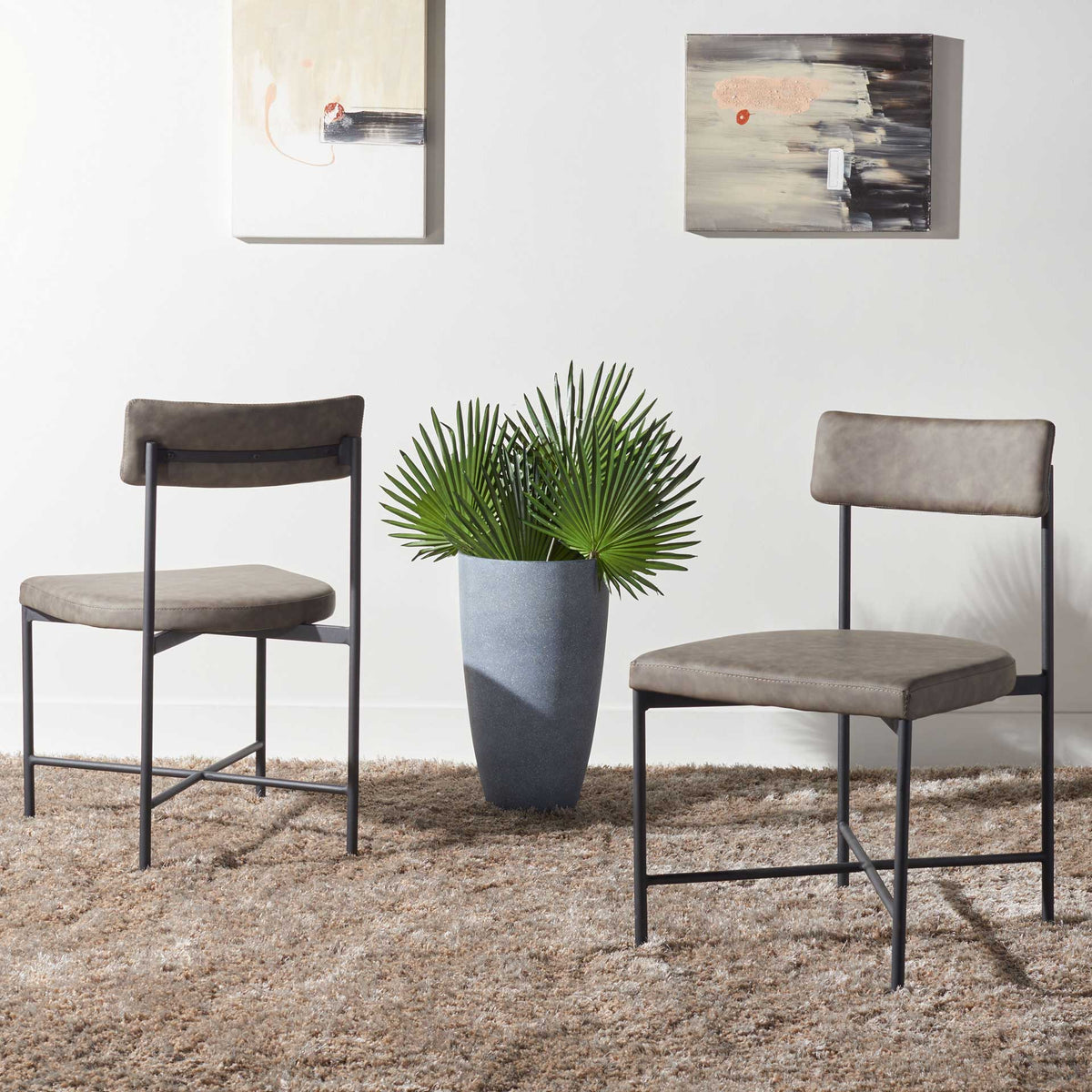 Gray upholstered dining chairs lend soft texture and clean lines to a contemporary space